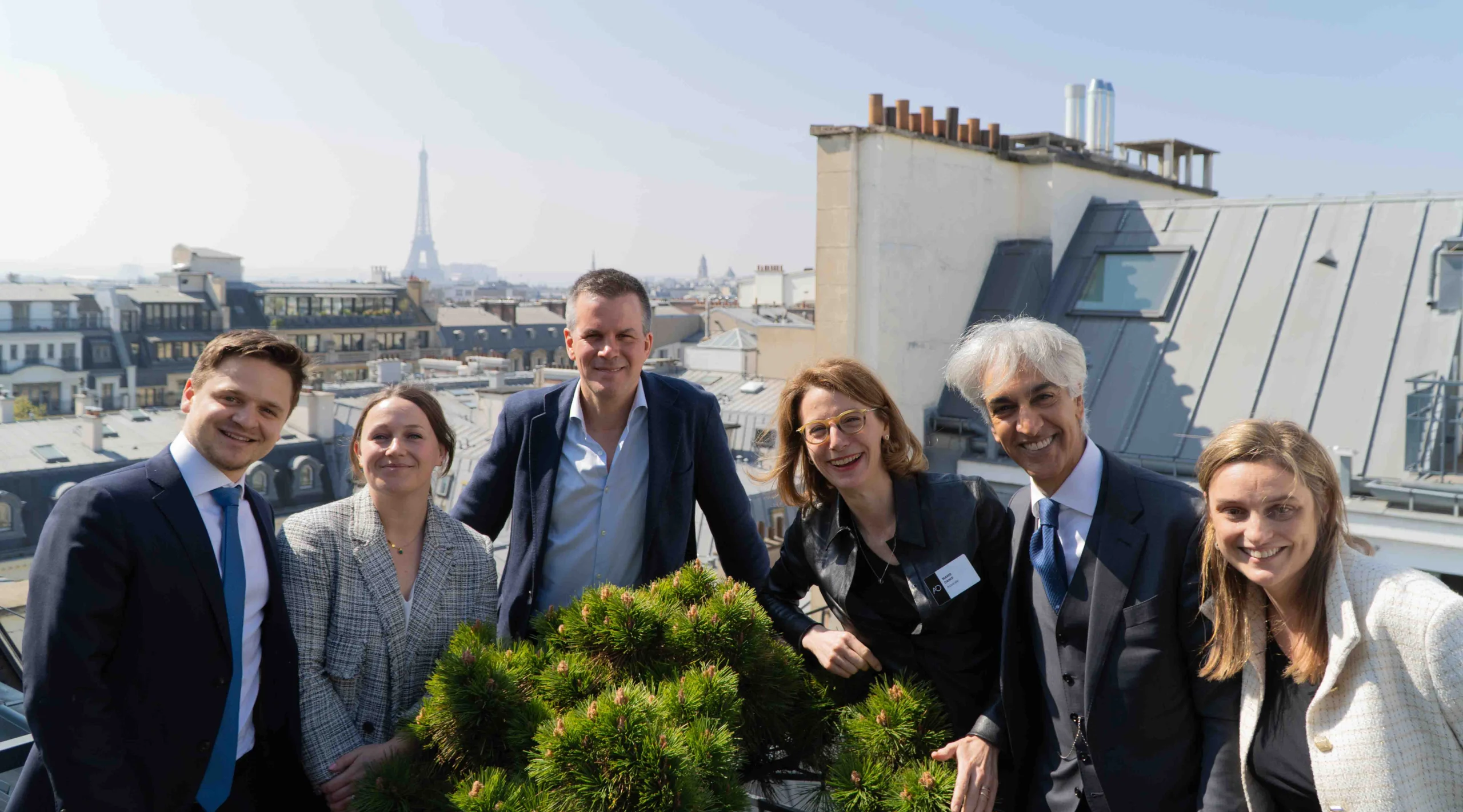 A group of people taking a photo in Paris